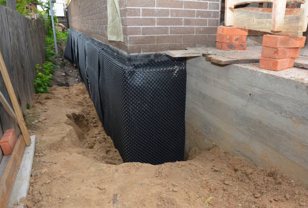 SJ Waterproofing Pros technician performing targeted Foundation Crack Repair assessment in New Palestine, IN